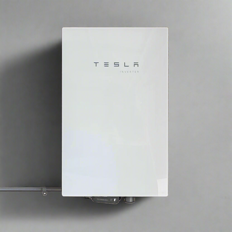 Tesla Powerwall battery energy storage system mounted on a wall.